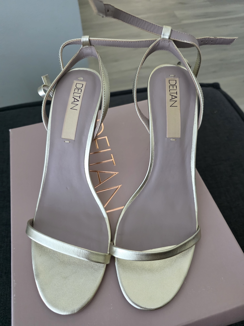 DELTAN Gold Leather Ankle‑Strap Stiletto Sandals